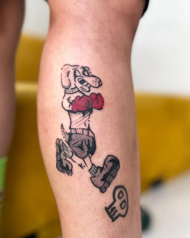 Tatuagem cachorro boxeador, panturrilha
